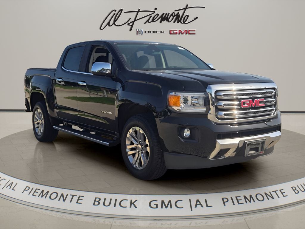 2016 GMC Canyon SLT in Onyx Black — front three-quarter view