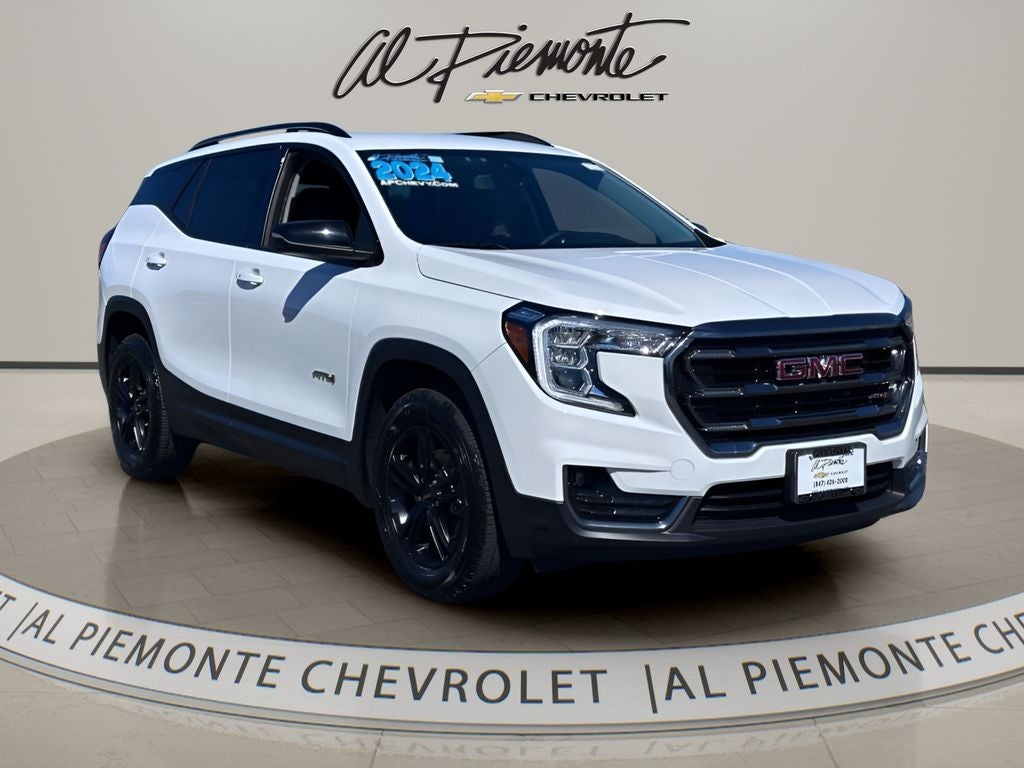 2024 GMC Terrain AT4 in Summit White — front three-quarter view